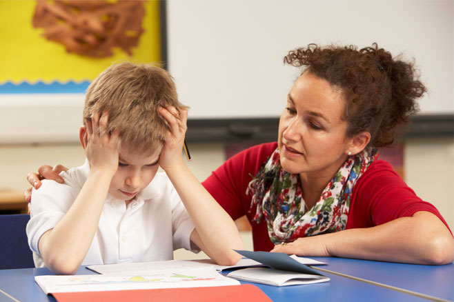 teacher helping stressed student